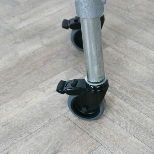 Industrial-silver-key-clamp-clothing-rail-with-wheels-4
